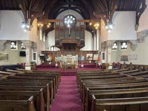 inside church with paintings on display